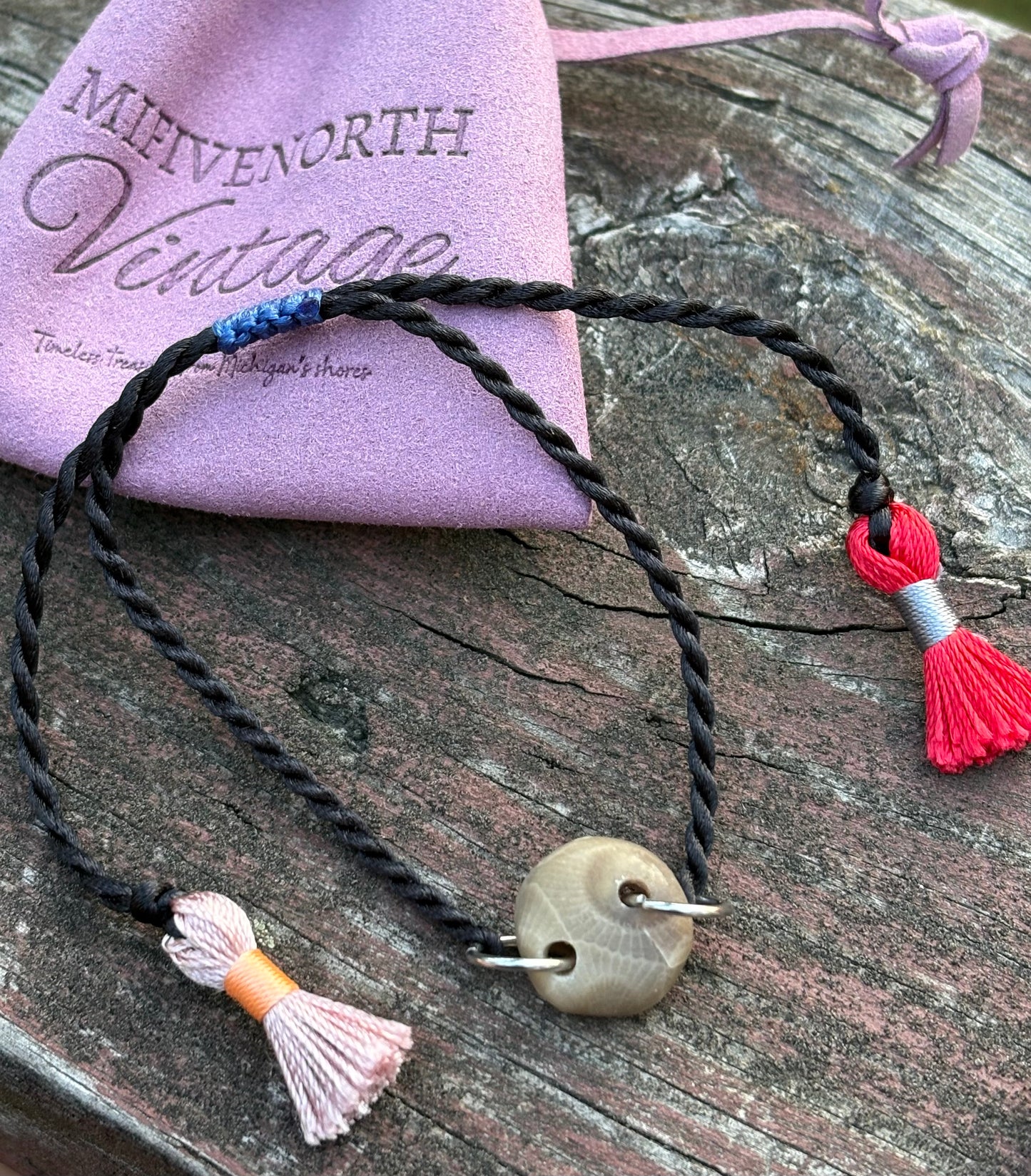 Petoskey Stone Adjustable Tassel Bracelet – Black with Pink + Red Tassels