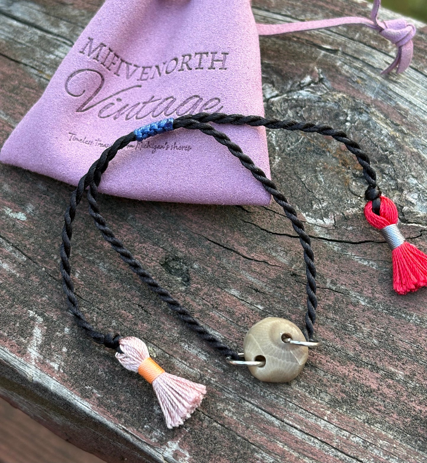 Petoskey Stone Adjustable Tassel Bracelet – Black with Pink + Red Tassels
