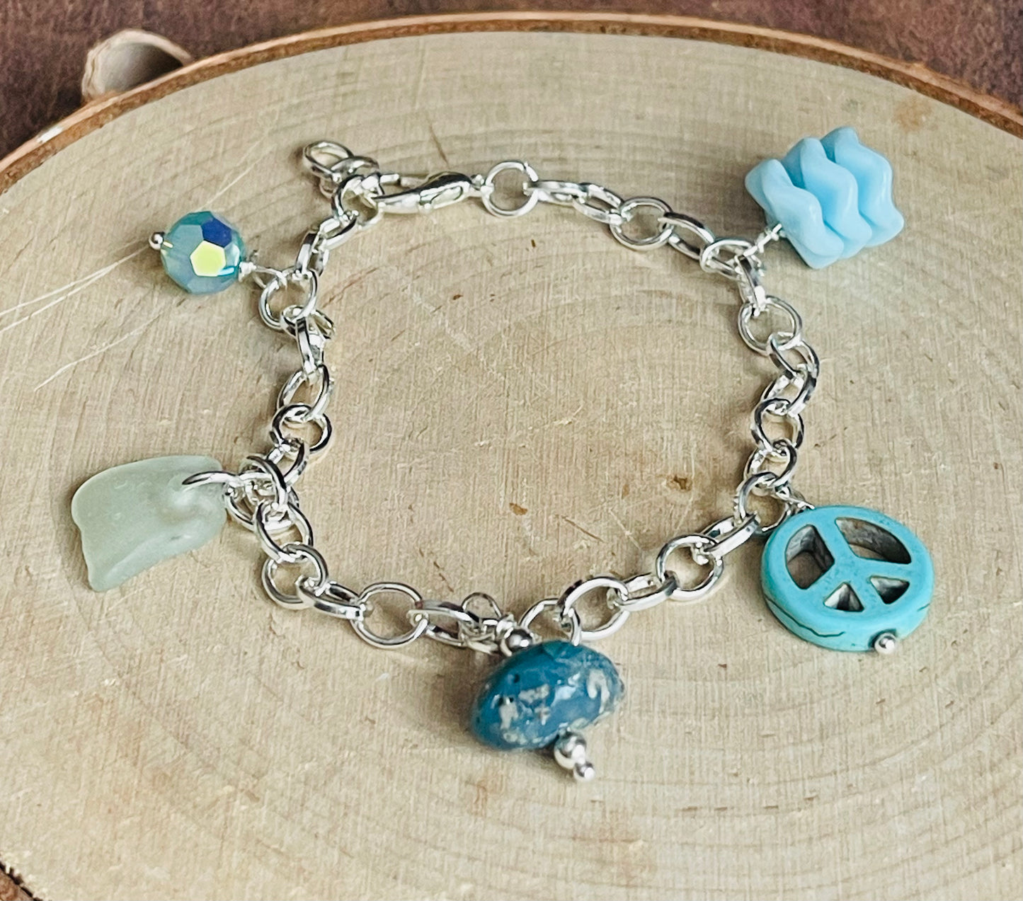 Baby blue charm bracelet with authentic Lake Michigan beach glass, Swarovski crystal, and Leland blue charms