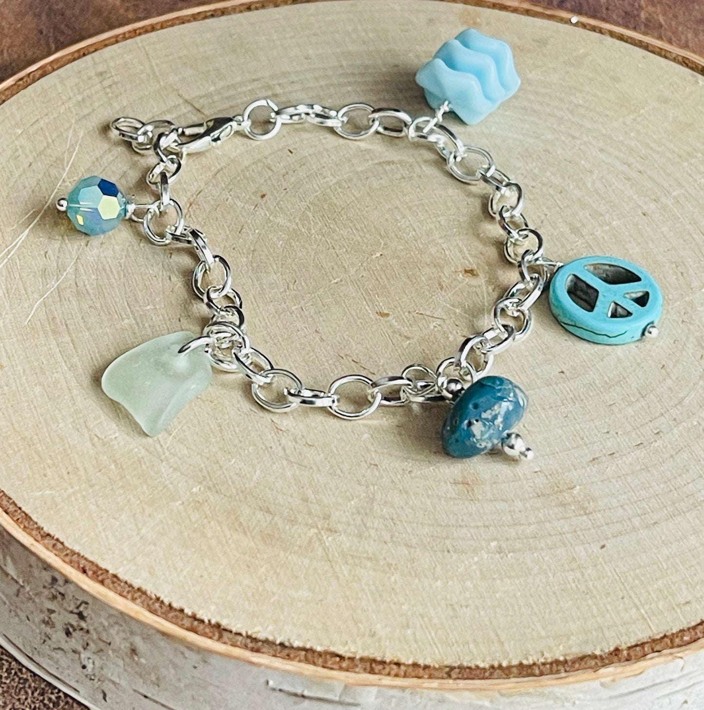 Baby blue charm bracelet with authentic Lake Michigan beach glass, Swarovski crystal, and Leland blue charms
